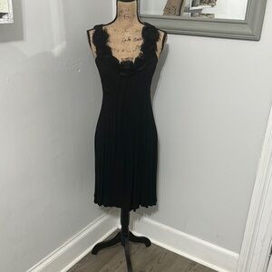 Chic Black Dress with Floral Neckline
